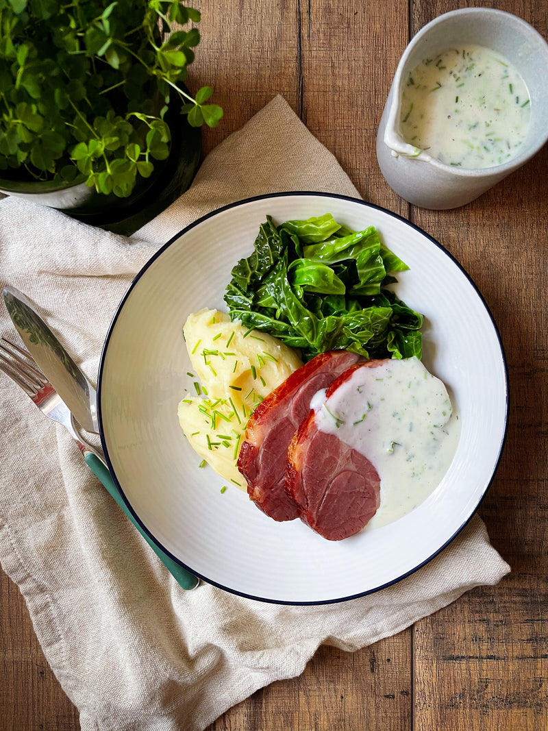 Smoked Collar of Bacon with Buttermilk Mashed Potato, Savoy Cabbage and Chive Sauce